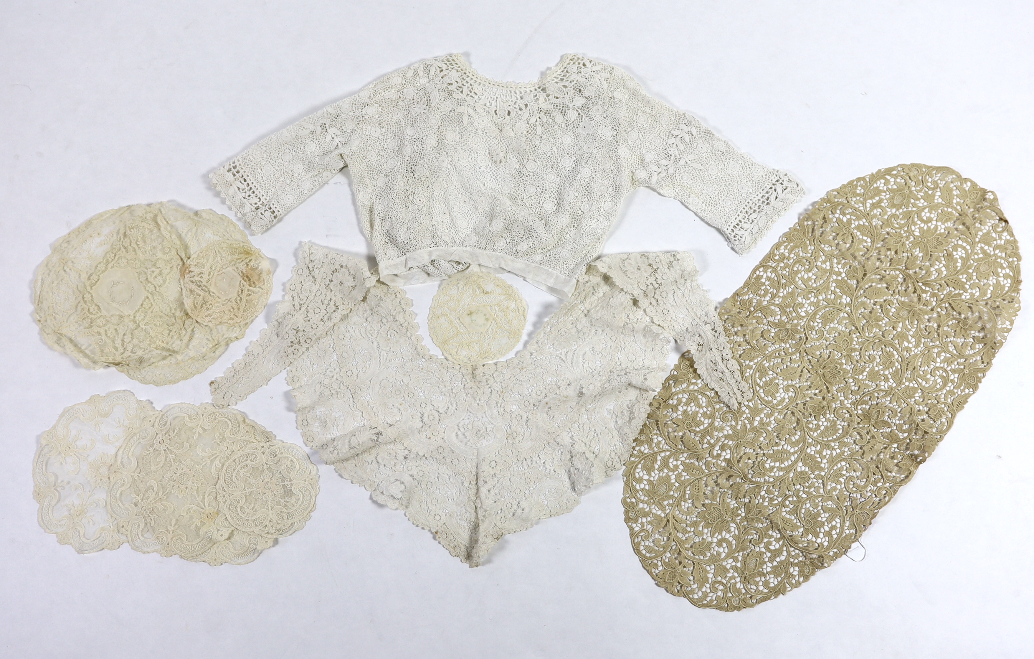 An Edwardian handmade Irish crocheted ladies blouse (small size), a Brussels hand bobbin lace Bertha with Point de Gaze insertions, two large and one small Normandy lace mats, four large and two smaller similar needle la